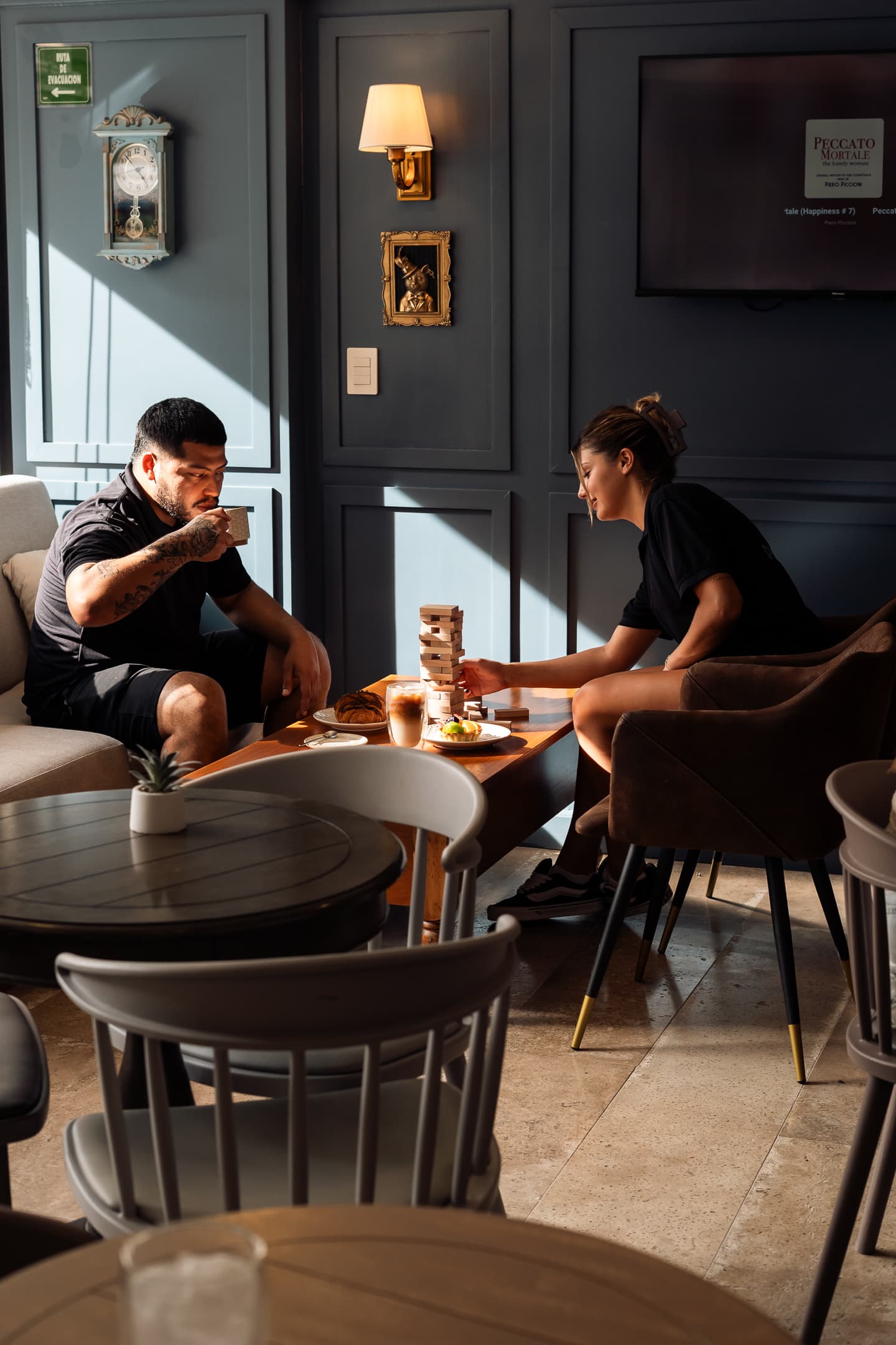 Friends sharing coffee and a game at Spirit Café.