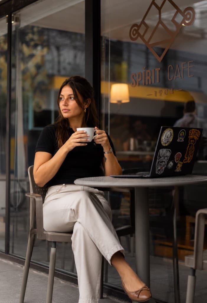 A guest enjoying coffee on the Spirit Café patio.